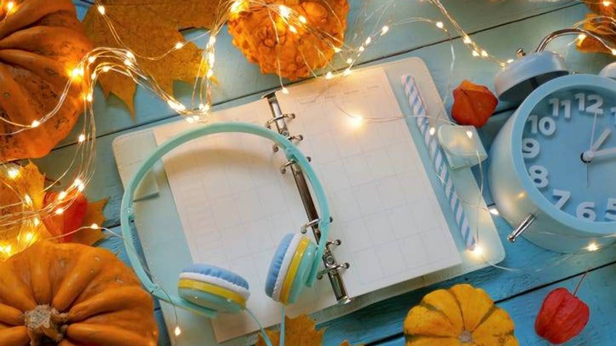 headphones on a planner with lights and pumpkins