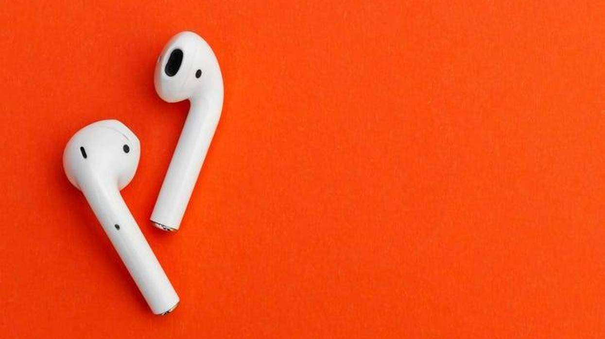 headphones on an orange background
