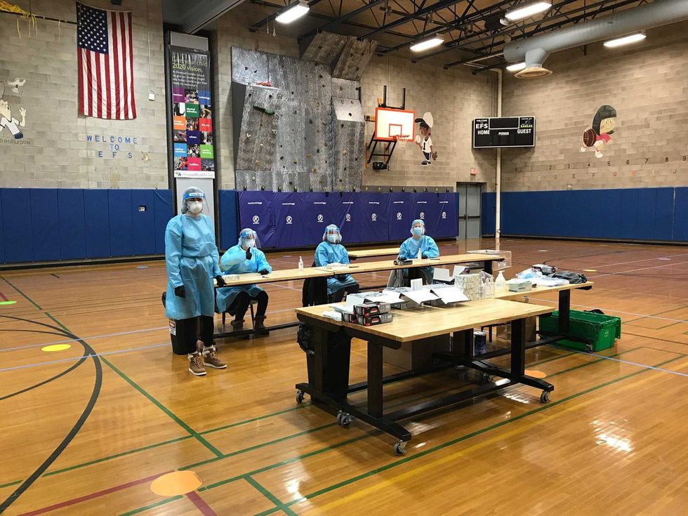 Health care workers from Brighton Eggert Pharmacy at Elmwood Franklin School.