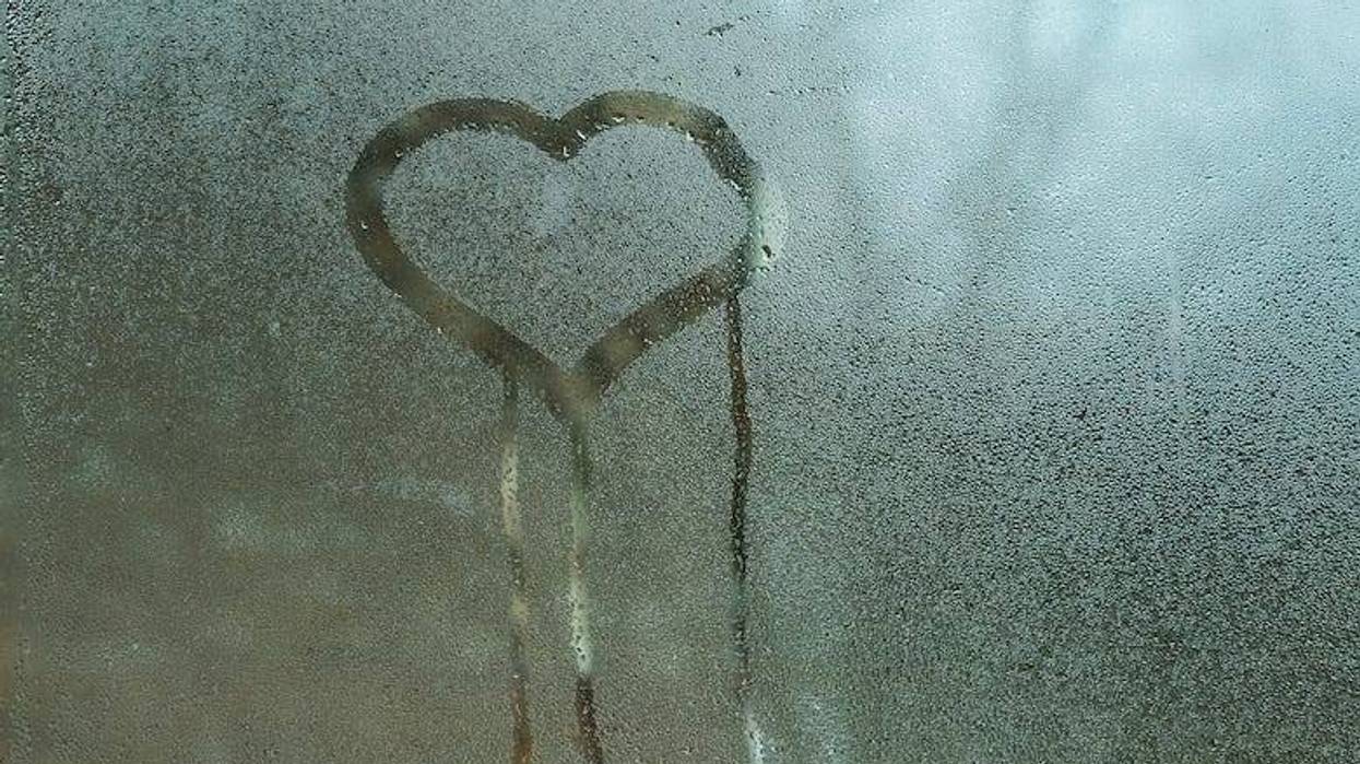 Heart drawn on condensation in window