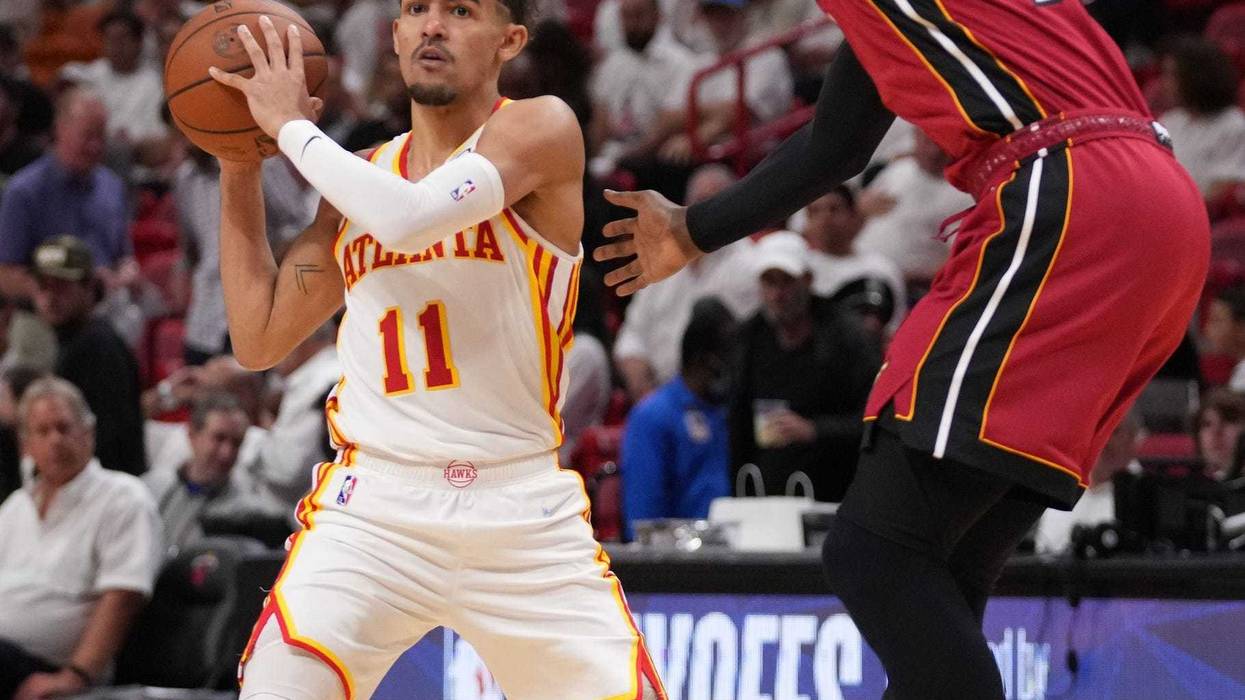 Heat C Bam Adebayo guards Trae Young