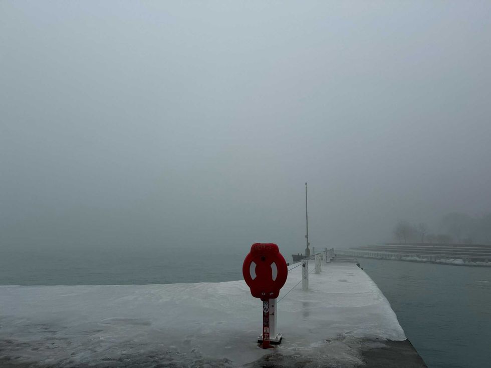 Heavy fog obscures the view from Belmont Harbor.