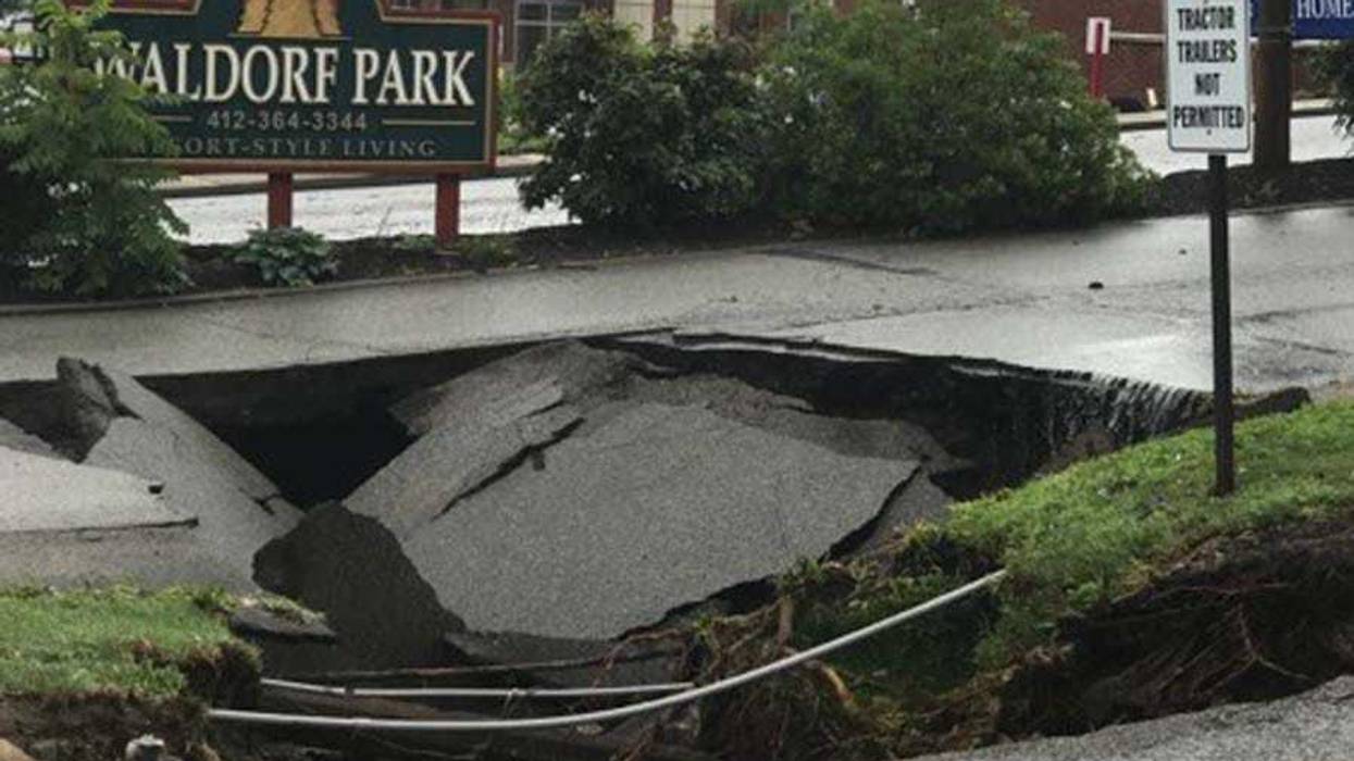 Heavy Rains Cause Sinkhole To Open Along McKnight Road