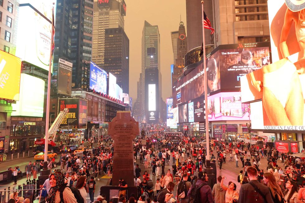 Heavy smoke fills the air in Times Square as the sun sets on June 6, 2023, in New York City