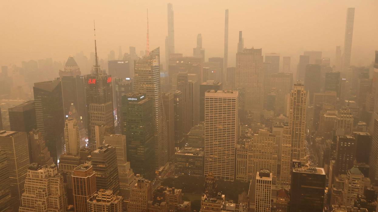 Heavy smoke shrouds buildings around Times Square in a view looking north from the Empire State Building as the sun sets on June 6, 2023, in New York City