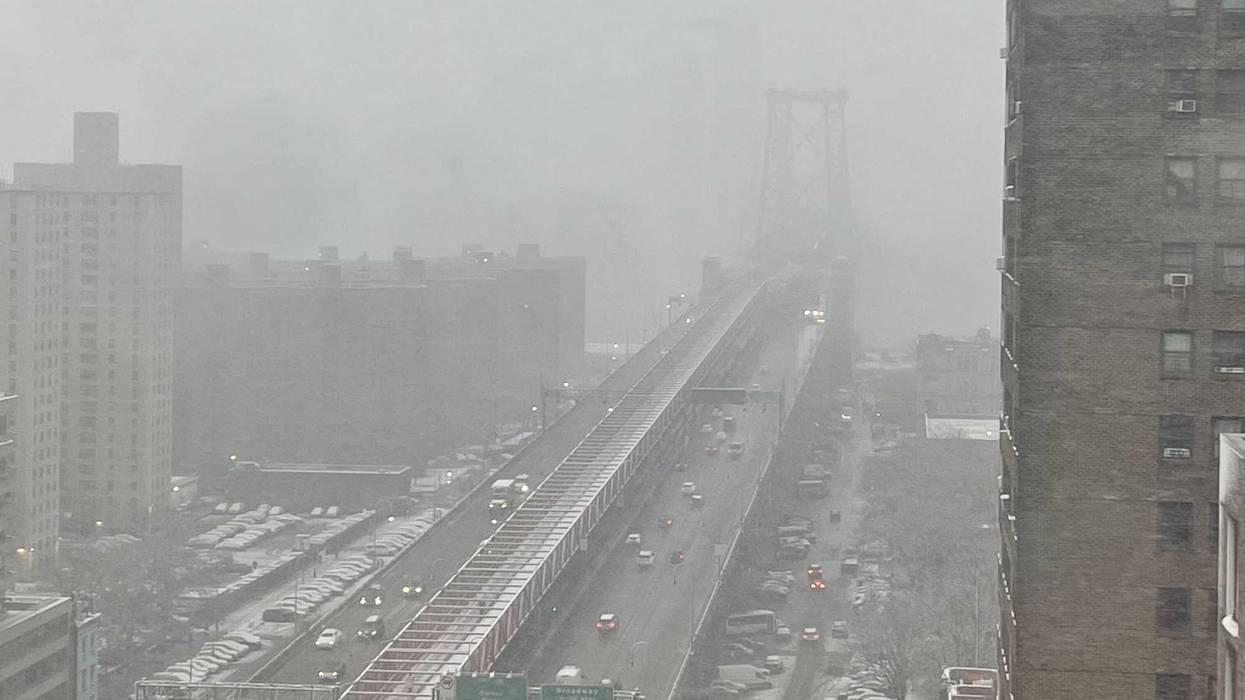 Heavy snow falls over the Williamsburg Bridge in the East Village on Feb. 13, 2024