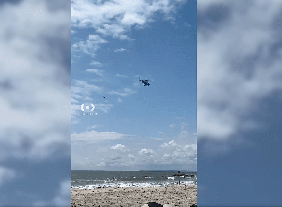 Helicopters patrolled beaches along the Rockaways on Tuesday
