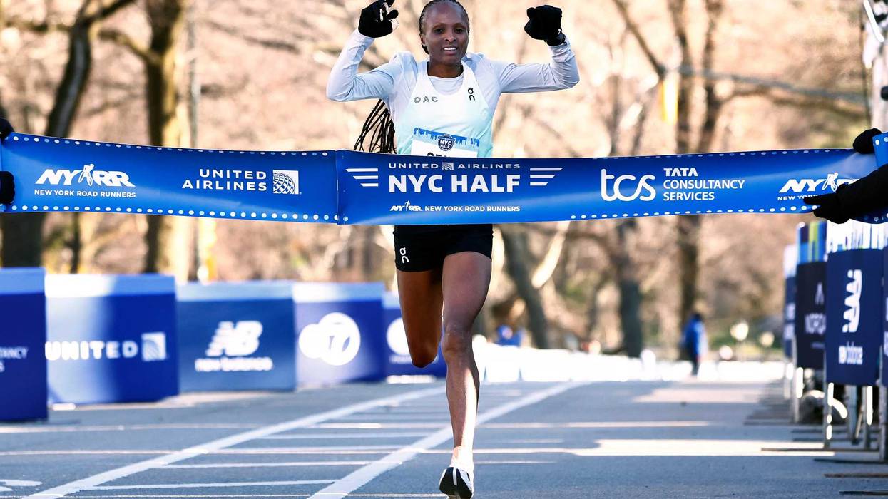 Hellen Obiri of Kenya crosses the finish line to win the Women's United Airlines NYC Half Marathon on March 19, 2023 in New York City.