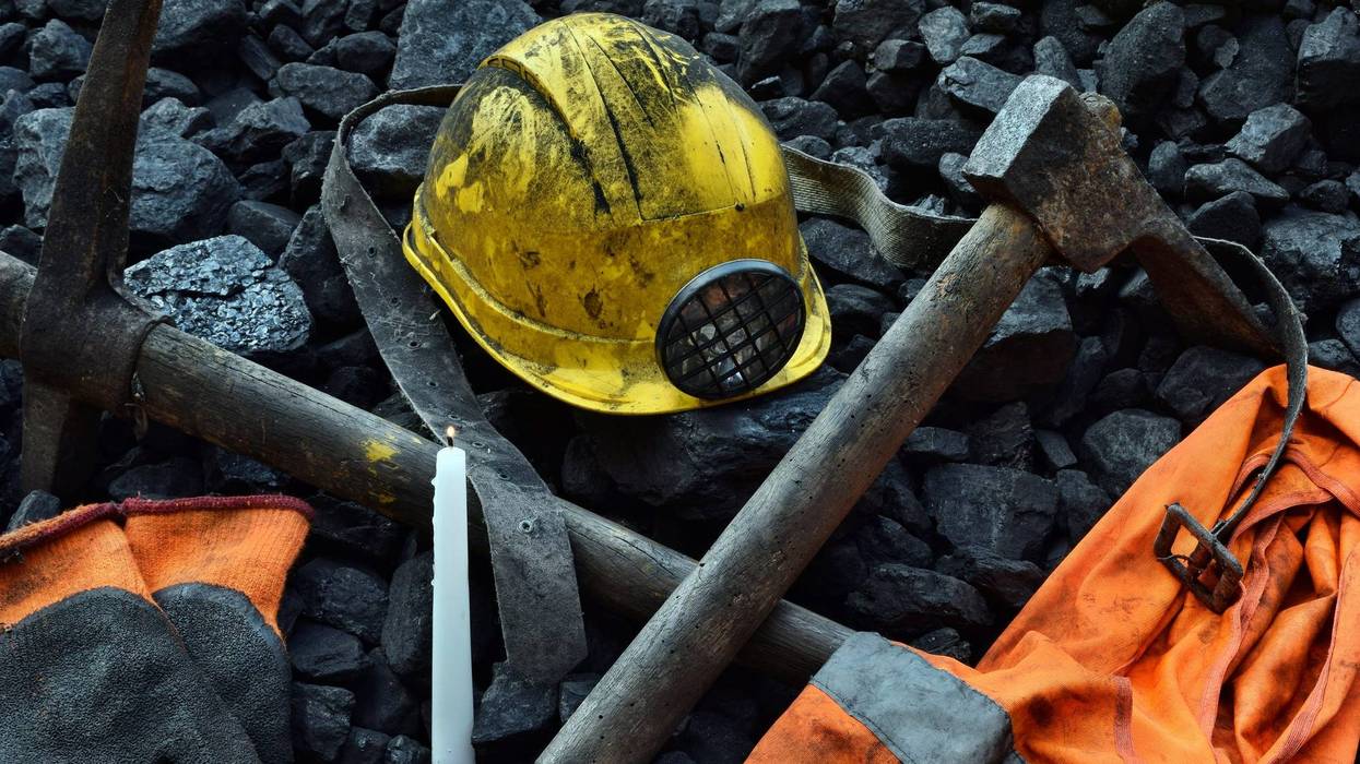 (Helmet, gloves, pickaxe, vest, belt) - stock photo