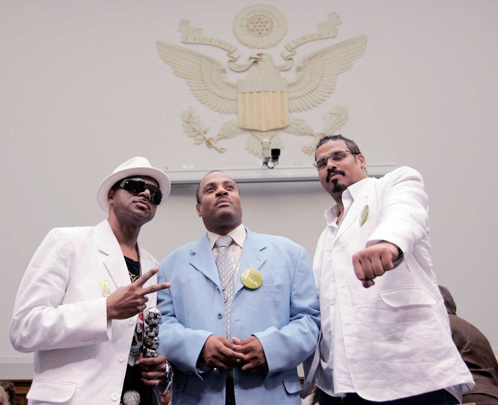 Hendogg from The Sugarhill Gang, left, Grandmaster Dee of Whodini, center, and Michael "Wonder Mike" Wright of The Sugarhill Gang, pose for a photo on Capitol Hill in Washington, June 11, 2008