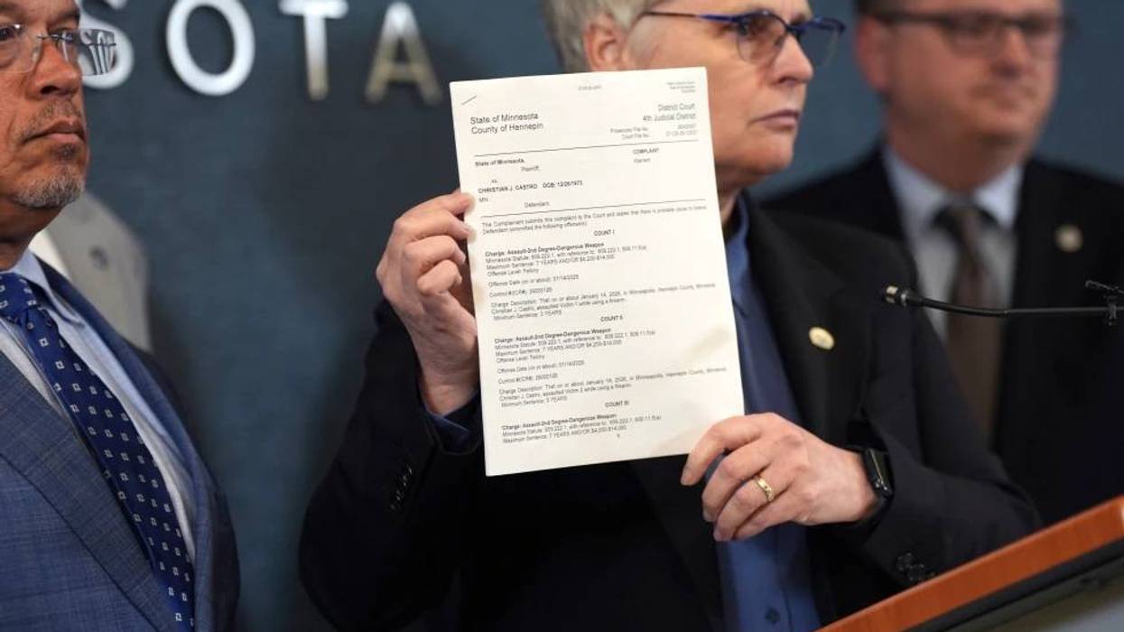 Hennepin County attorney Mary Moriarty holds up a document containing charges against ICE agent Christian Castro during a news conference at the Hennepin County Government Center in Minneapolis, on Monday, May 18, 2026.