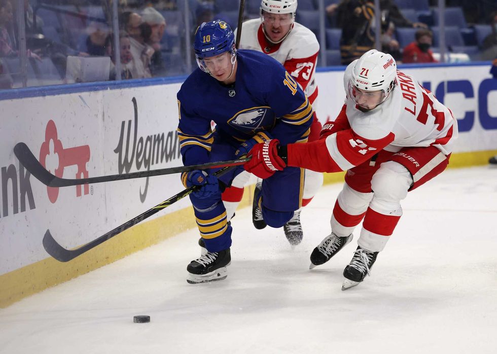 Henri Jokiharju and Dylan Larkin