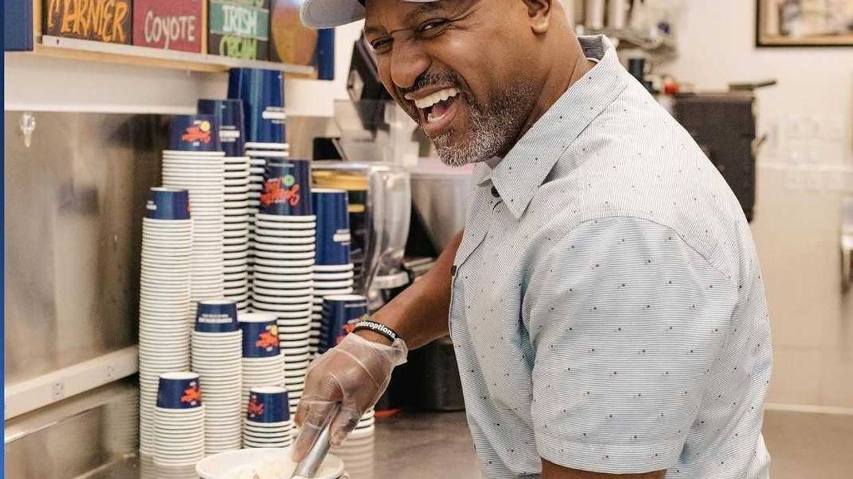 Henry Lake serving up scoops of "Henry by the Lake" ice cream at Sebastian Joe's to help benefit the University of Minnesota's Masonic Children's Hospital.