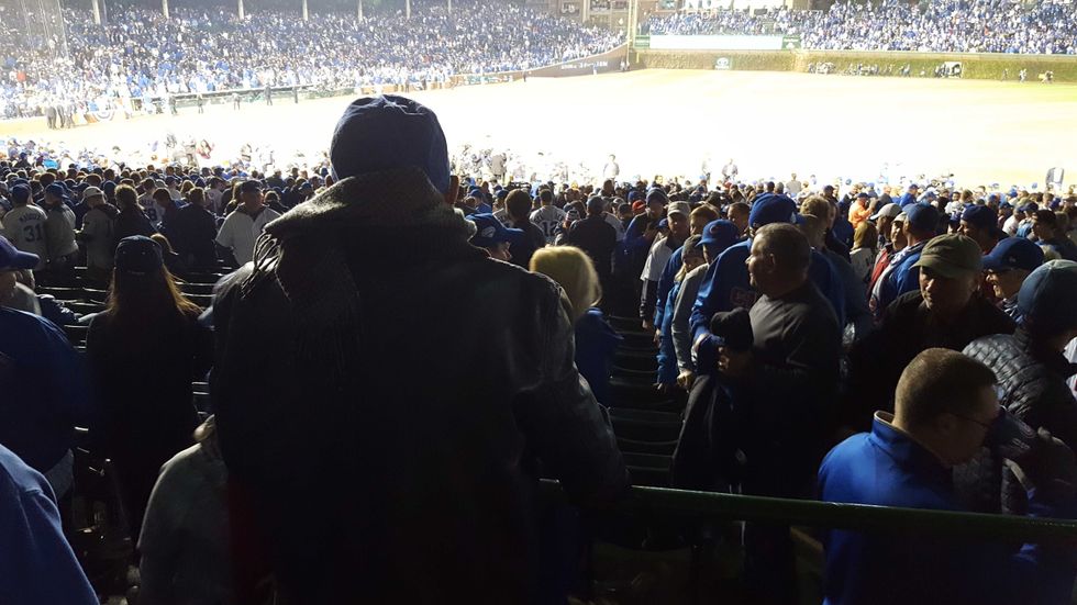 Herb Spiegel watches a Cubs game at Wrigley Field.