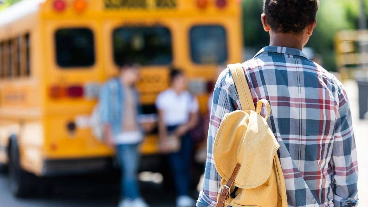 high school student with back pack