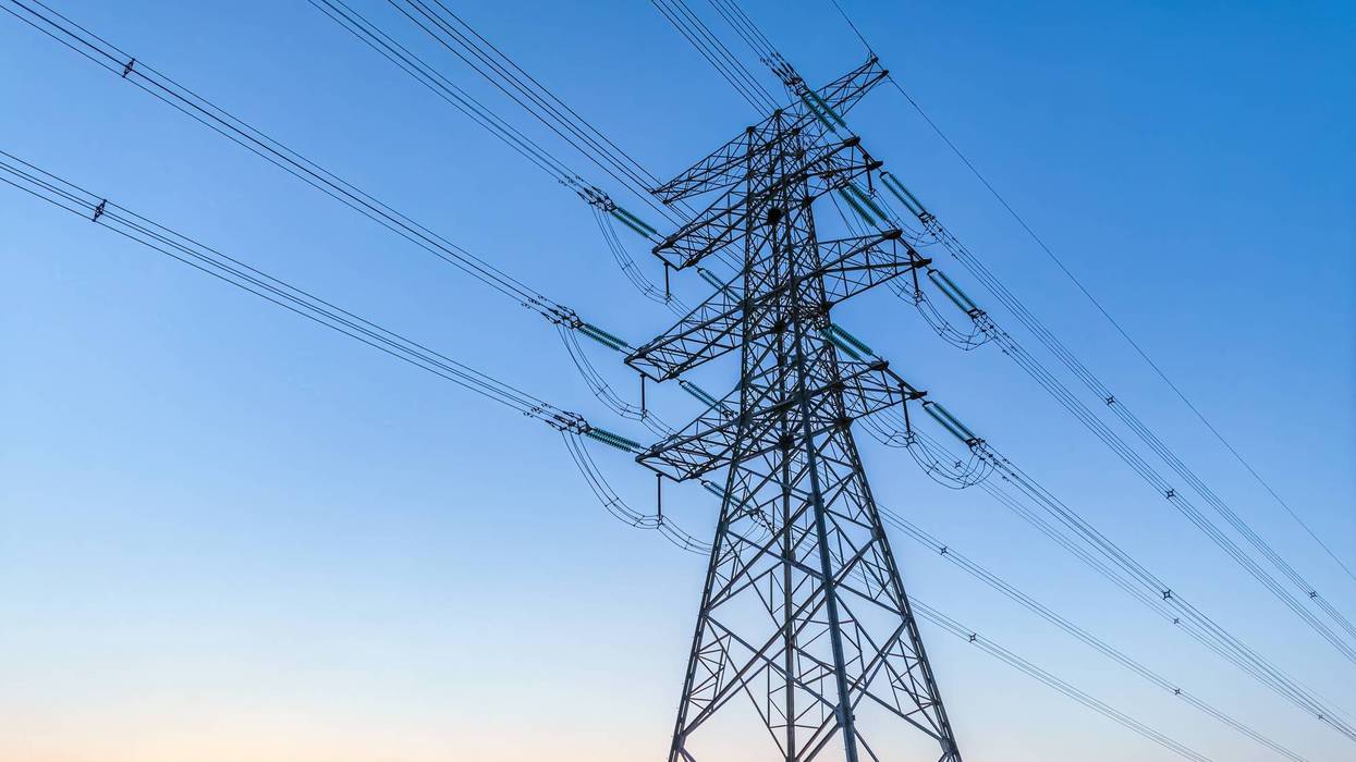 High voltage electricity tower and natural scenery at sunset