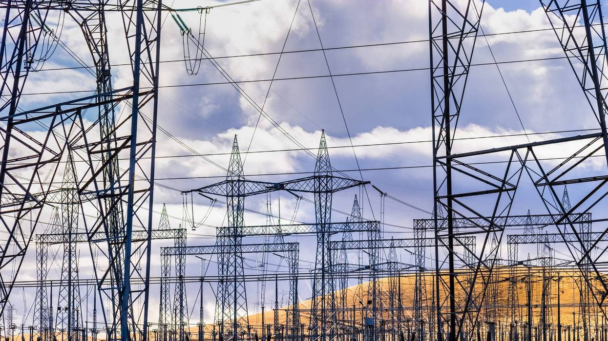 High voltage electricity towers and power lines at a substation in Central California; a substation is a part of an electrical generation, transmission, and distribution system.