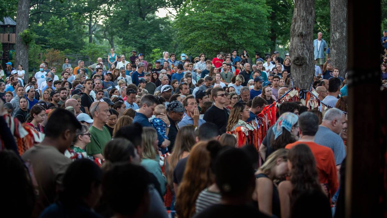 Highland Park community gathers at local park for vigil at sunset.