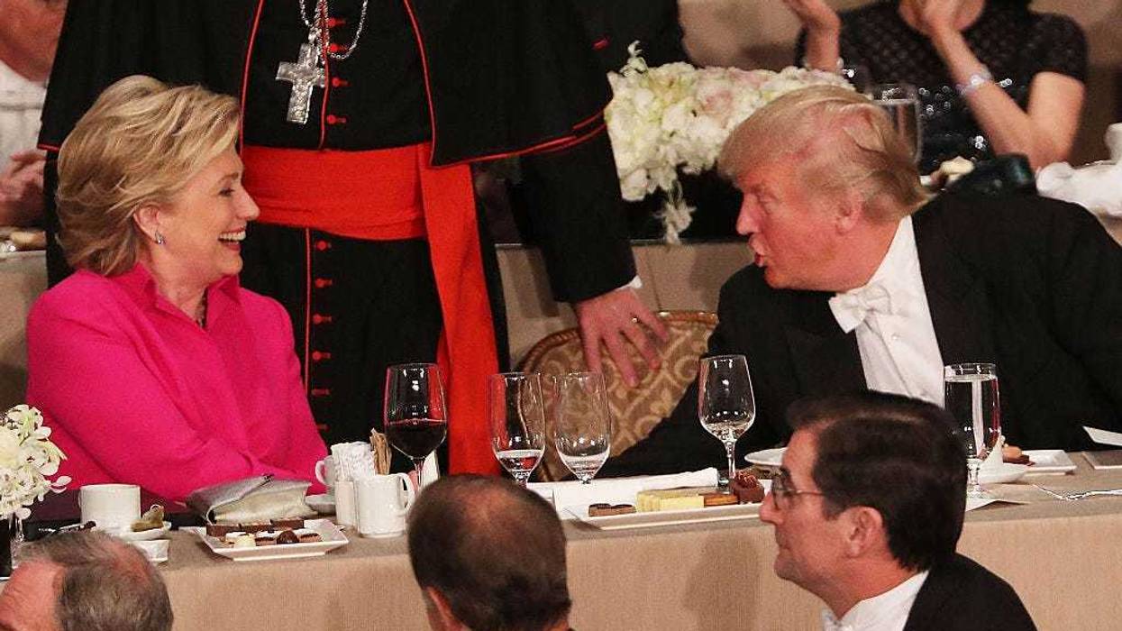 Hillary Clinton speaks briefly with Donald Trump while attending the annual Alfred E. Smith Memorial Foundation Dinner at the Waldorf Astoria on October 20, 2016 in New York City.The white-tie dinner, which benefits Catholic charities and celebrates former Governor of New York Al Smith, has been attended by presidential candidates since 1960 and gives the candidates an opportunity to poke fun at themselves and each other. (Photo by Spencer Platt/Getty Images)