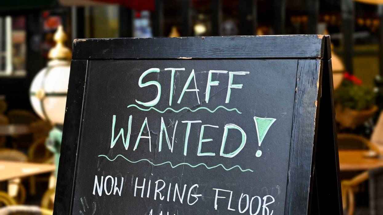 Hiring sign outside of an establishment.