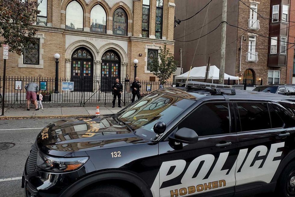 Hoboken Police officers stand watch outside the United Synagogue of Hoboken, Thursday, Nov. 3, 2022, in Hoboken, New Jersey