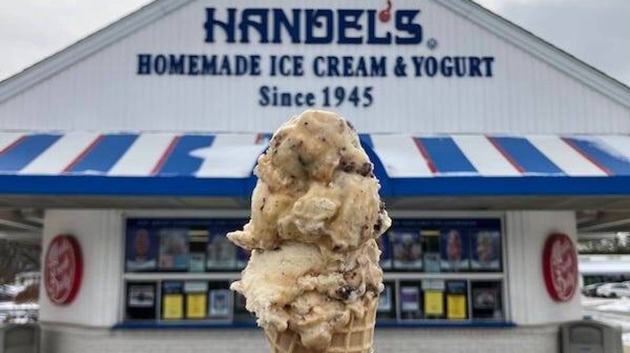Holding an ice cream cone from Handel’s Homemade Ice Cream shop