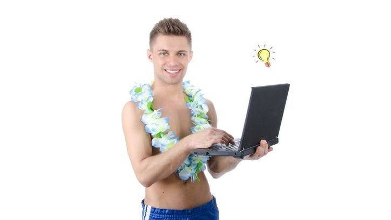 Holiday and relaxation. Work on vacation. Young attractive man holding a laptop. Isolated. White background.