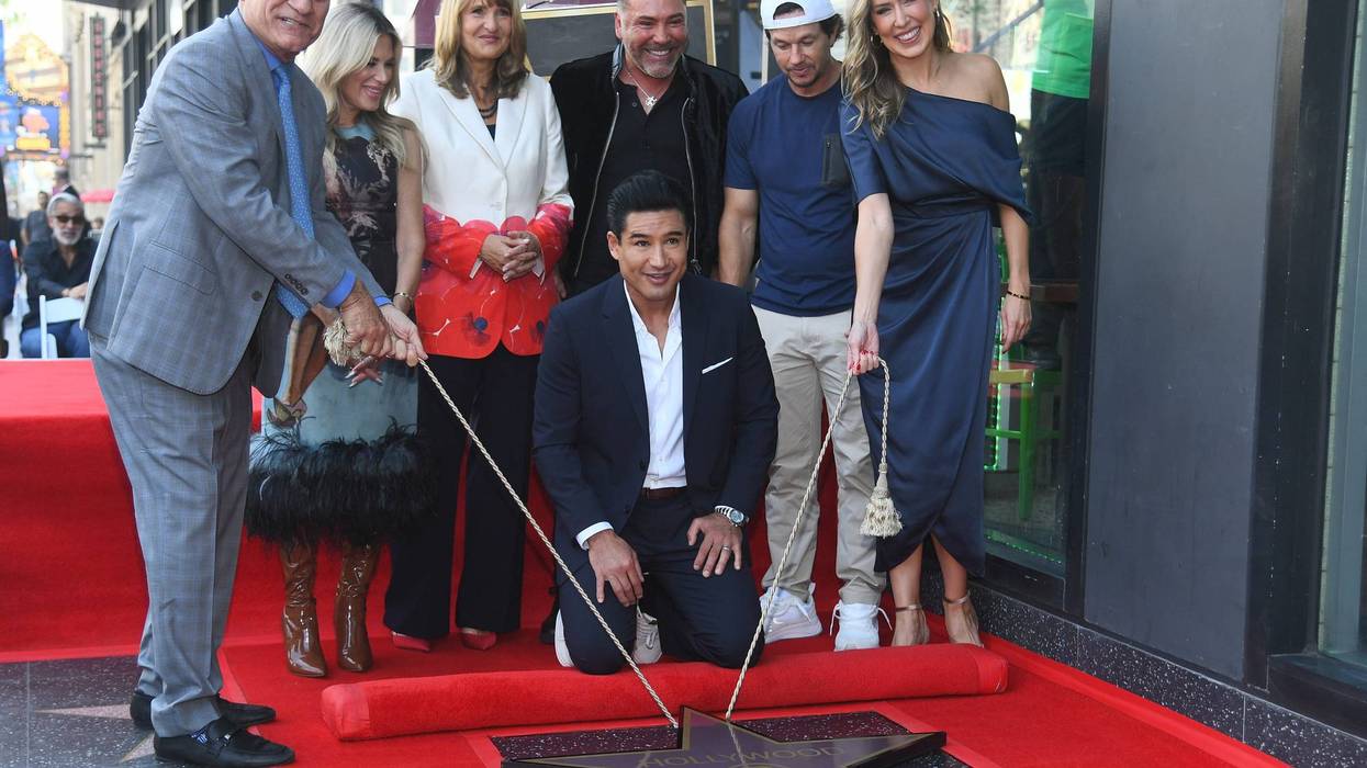 HOLLYWOOD, CALIFORNIA - OCTOBER 10: Oscar Steve Nissen,Ellen K, Valari Staab, Mario Lopez, Oscar De La Hoya, Mark Wahlberg and Sarah Zurell attend a ceremony honoring Mario Lopez With A Star On The Hollywood Walk Of Fame on October 10, 2024 in Hollywood, California.