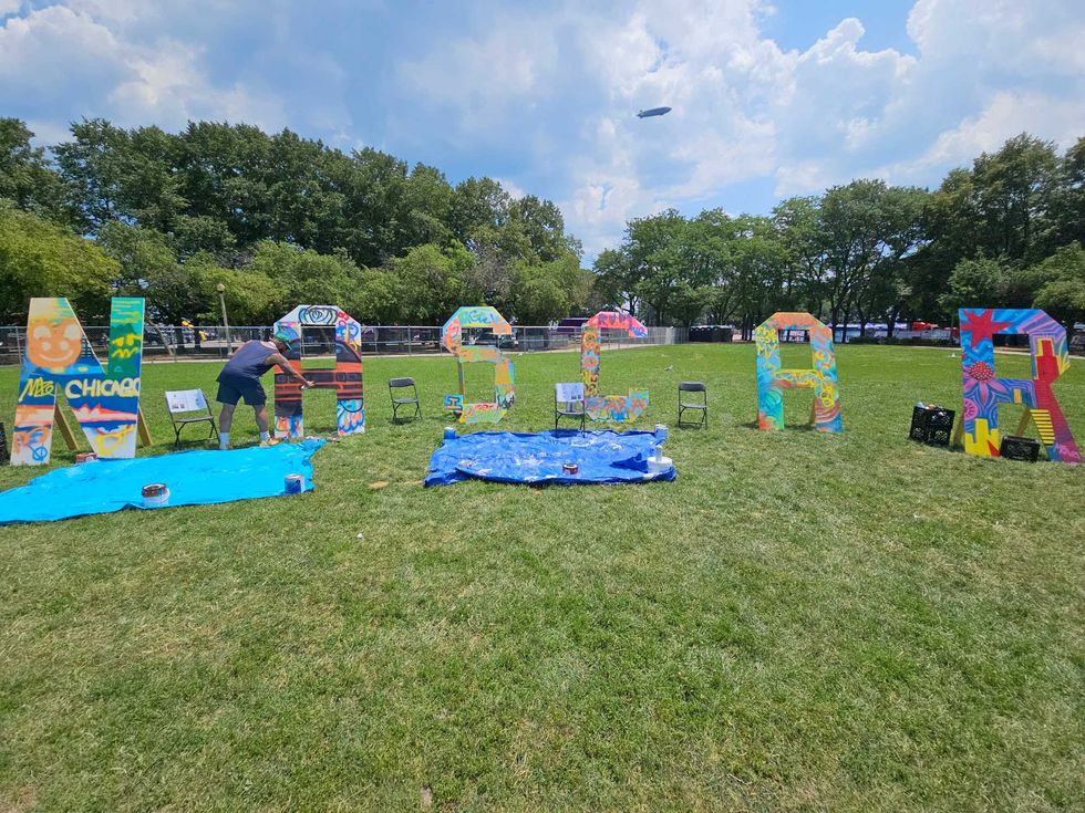 Hollywood sign style wooden cut outs instead read NASCAR, as local artist led non-profit Paint the City offers a number of activities for kids and adults at the free NASCAR Village in Butler Field.