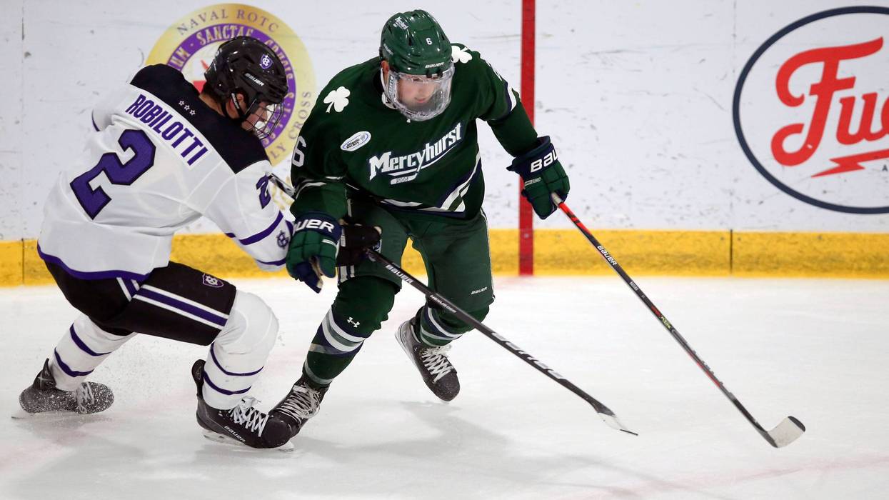 Holy Cross's Jack Robilotti (2) defends Mercyhurst's Carson Briere (6) during the first half of an NCAA hockey game on Friday, Nov. 12, 2021, in Worcester, Mass.