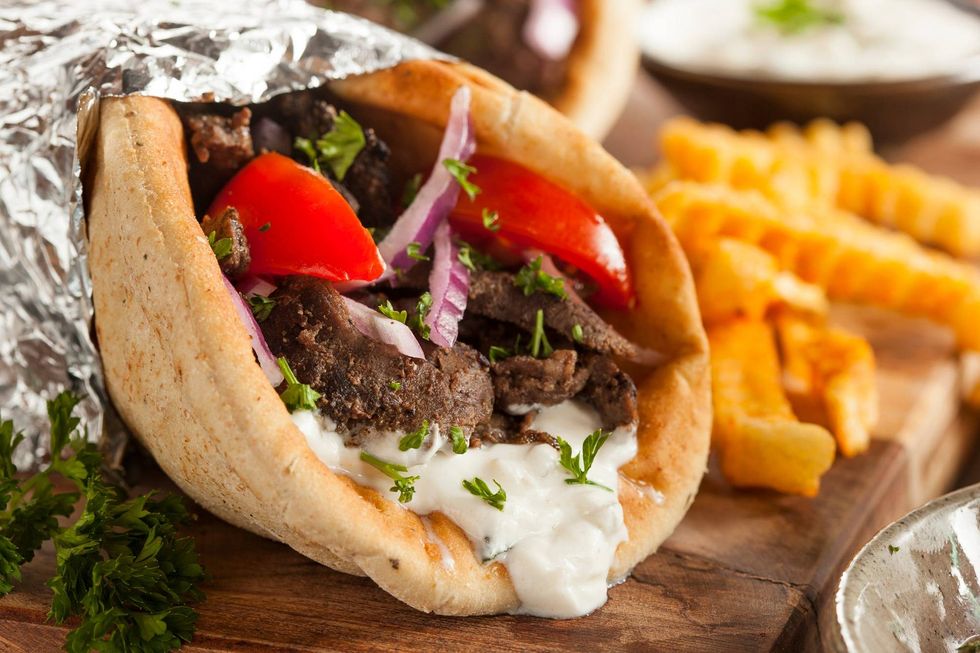 Homemade Meat Gyro with Tzatziki Sauce, tomatoes and French Fries