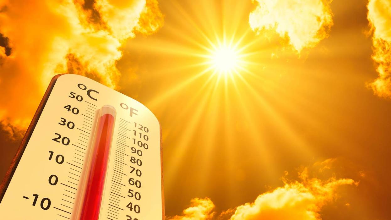 hot temperature,Thermometer on yellow sky with sun shining