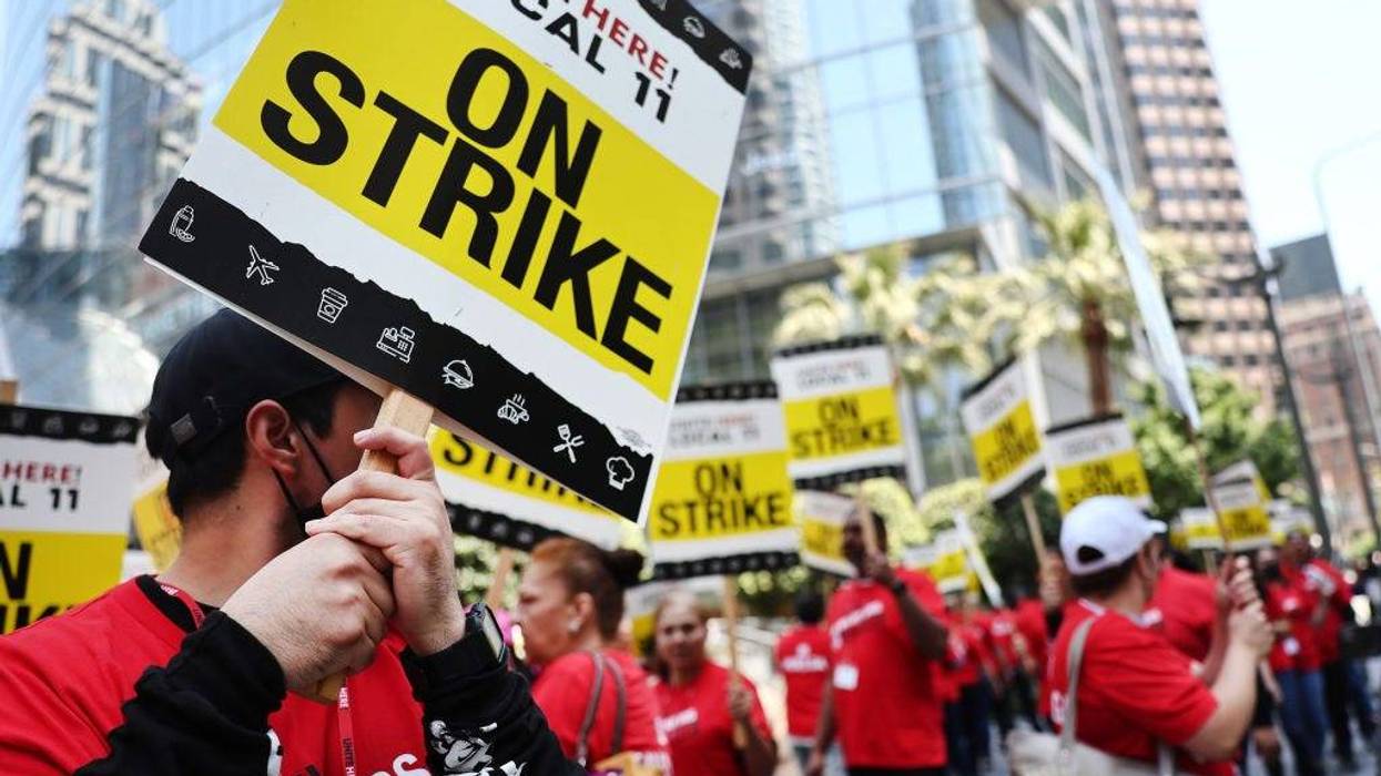 Hotel workers with Unite Here Local 11 picket outside the InterContinental hotel on the first day of a strike by union members at many major hotels in Southern California on July 2, 2023 in Los Angeles, California.