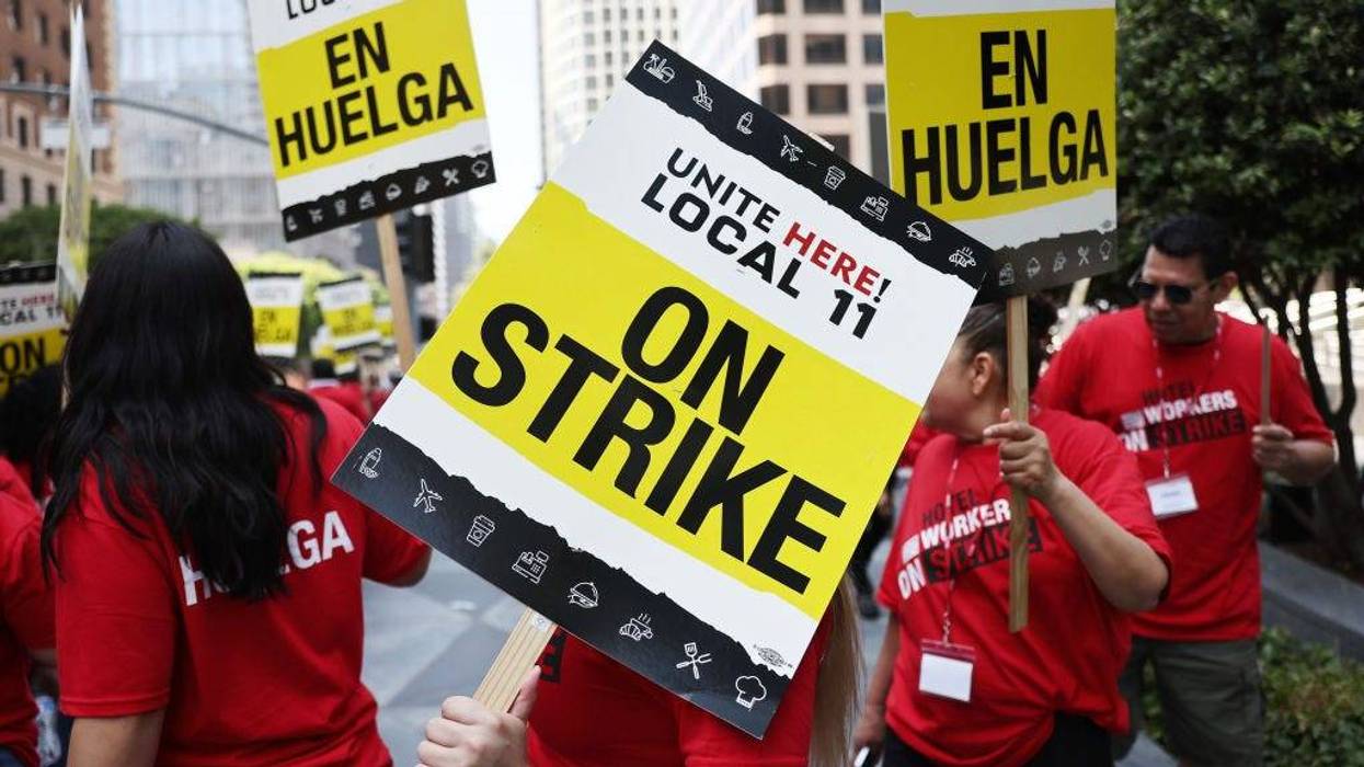 Hotel workers with Unite Here Local 11 picket outside the InterContinental hotel on the first day of a strike by union members at many major hotels in Southern California on July 2, 2023 in Los Angeles, California.