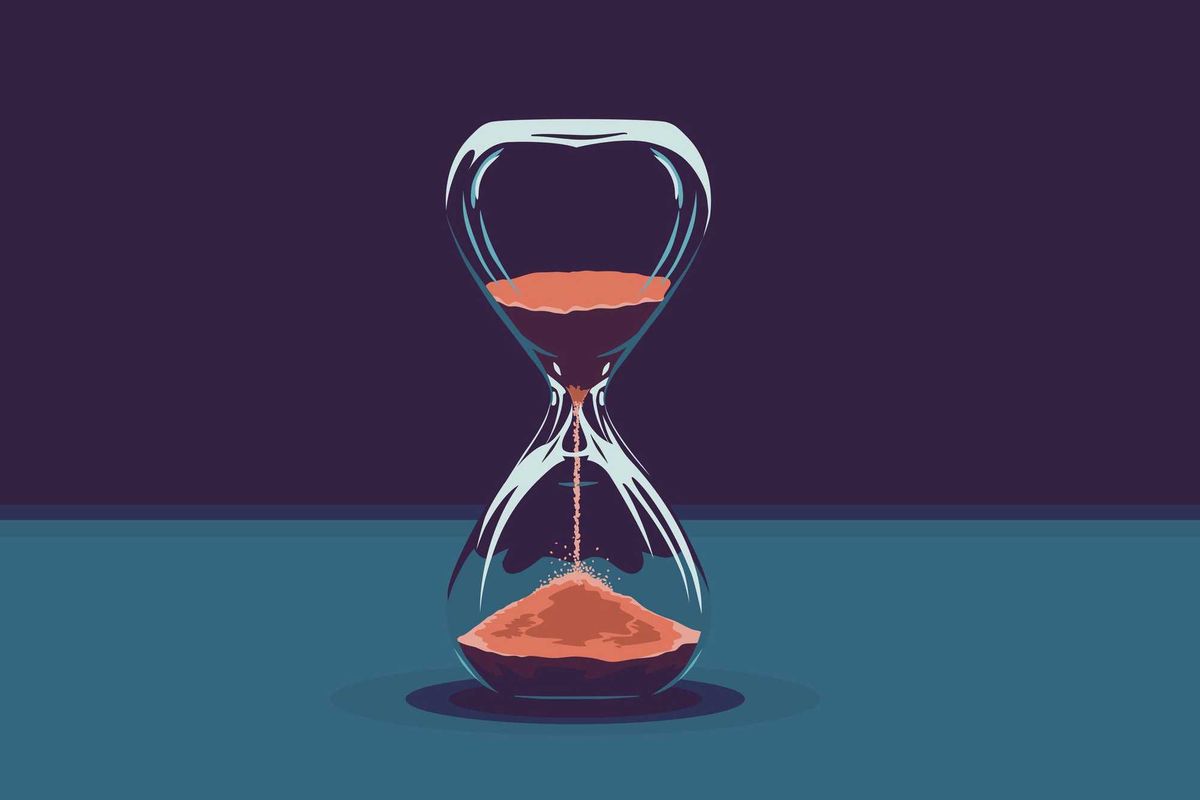 Hourglass with red sand.
