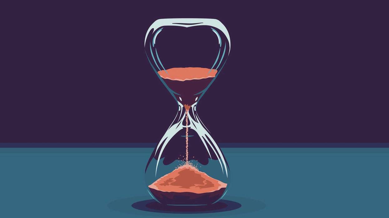 Hourglass with red sand.