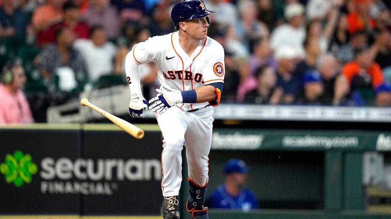 Houston Astros' Alex Bregman tosses his bat after hitting a RBI double against the Kansas City Royals