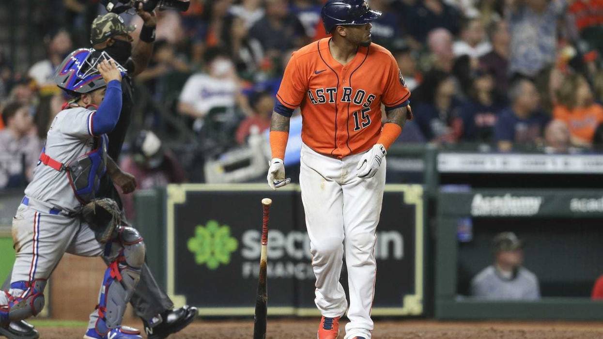 Houston Astros catcher Martin Maldonado (15) watches his two run home run against the Texas Rangers in the fifth inning at Minute Maid Park.