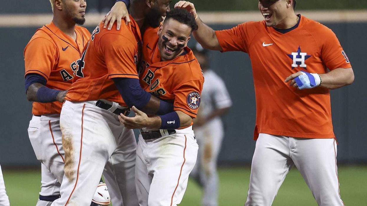 Houston Astros designated hitter Yordan Alvarez (44) celebrates with teammates after driving in a run during the ninth inning against the Chicago White Sox at Minute Maid Park.