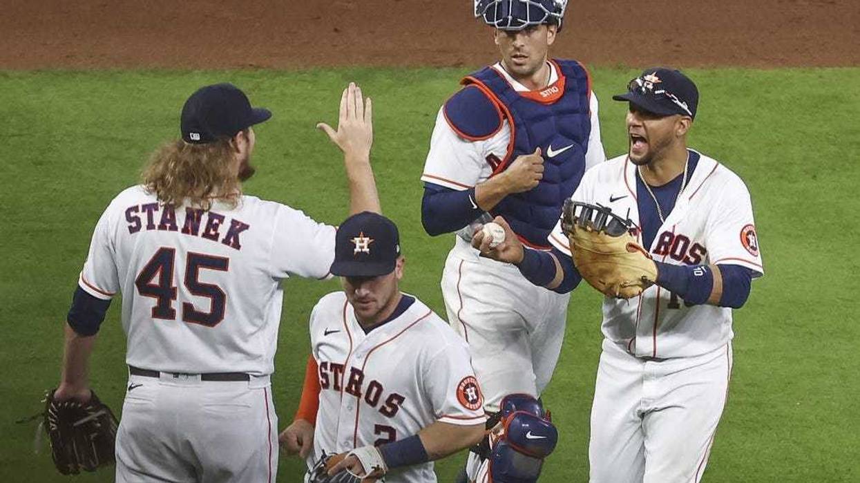 Houston Astros first baseman Yuli Gurriel (10) celebrates with relief pitcher Ryne Stanek (45) after the Astros defeated the Seattle Mariners at Minute Maid Park.