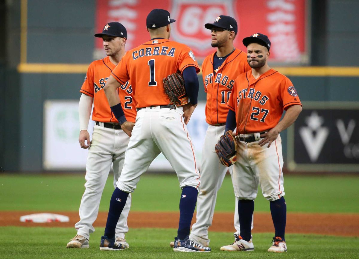 Houston Astros infielders Alex Bregman (2) , Carlos Correa (1), Yuli Gurriel (10) and Jose Altuve stand during a pitching change against the Washington Nationals during the eighth inning in game seven of the 2019 World Series at Minute Maid Park.