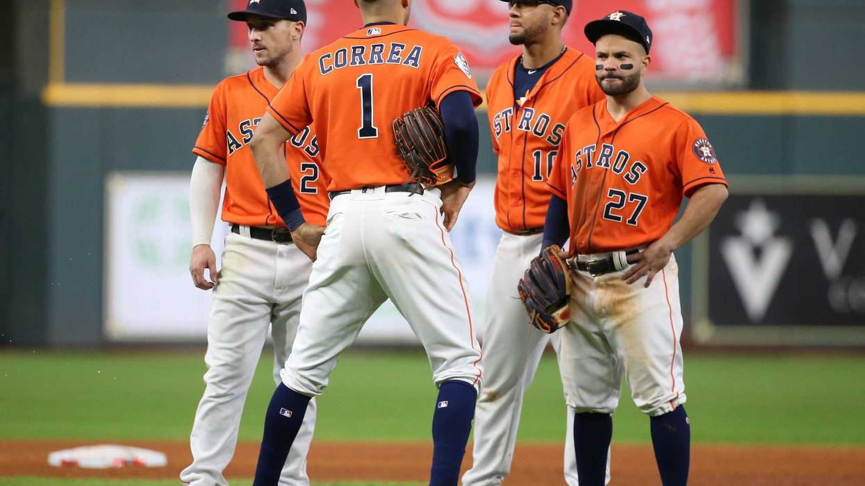 Houston Astros infielders Alex Bregman (2) , Carlos Correa (1), Yuli Gurriel (10) and Jose Altuve stand during a pitching change against the Washington Nationals during the eighth inning in game seven of the 2019 World Series at Minute Maid Park.