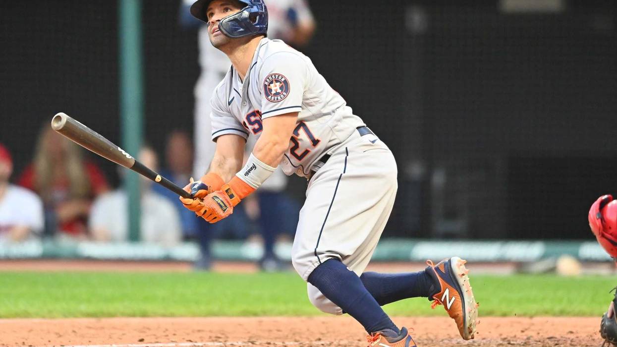 Houston Astros second baseman Jose Altuve (27) hits a grand slam during the fifth inning against the Cleveland Indians at Progressive Field.