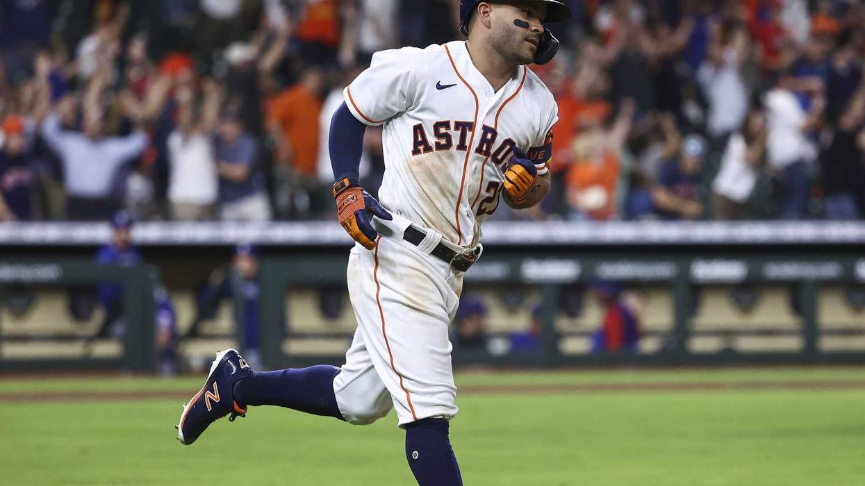 Houston Astros second baseman Jose Altuve (27) hits a walk-off grand slam home run during the tenth inning against the Texas Rangers at Minute Maid Park.