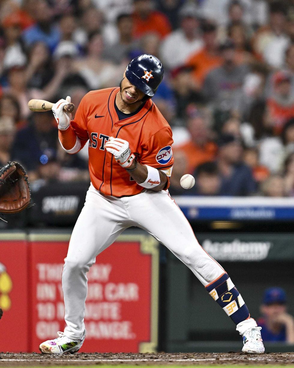 Houston Astros shortstop Jeremy Pena (3) hit by a pitch in the second inning against the Chicago Cubs at Daikin Park.