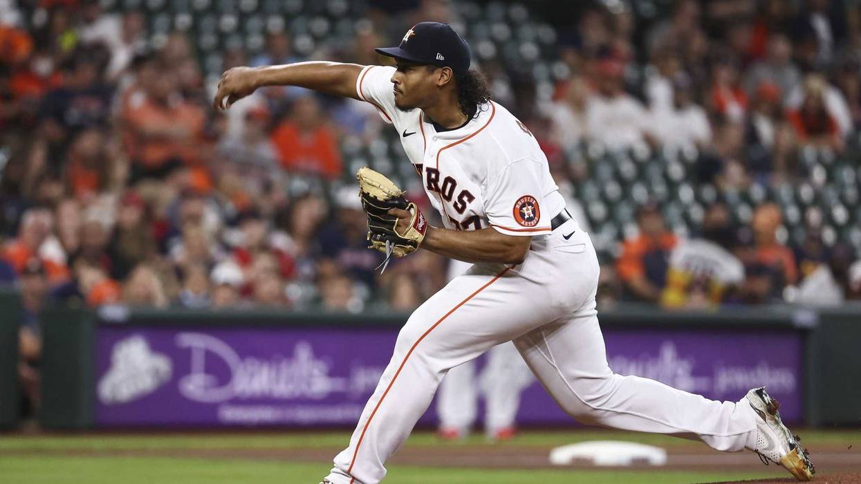 Houston Astros starting pitcher Luis Garcia (77) delivers a pitch during the first inning against the Boston Red Sox at Minute Maid Park.