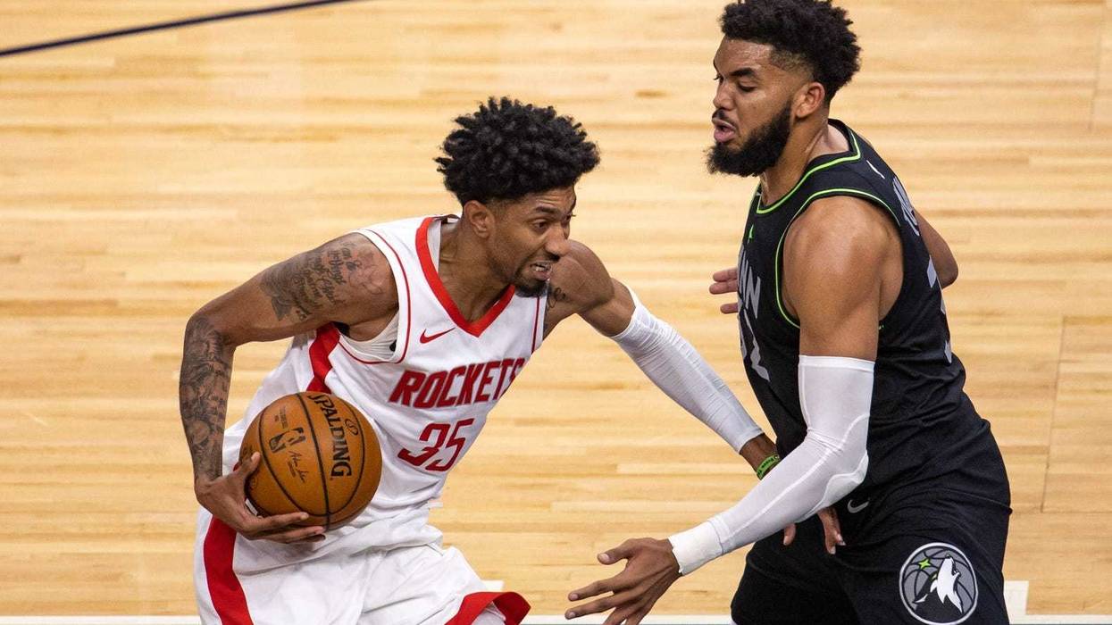 Houston Rockets center Christian Wood (35) drives to the basket as Minnesota Timberwolves center Karl-Anthony Towns (32) plays defense in the second half at Target Center.