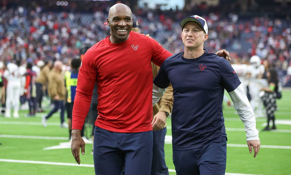 Houston Texans head coach DeMeco Ryans (left) and offensive coordinator Bobby Slowik walk off the field after the game against the Arizona Cardinals at NRG Stadium.