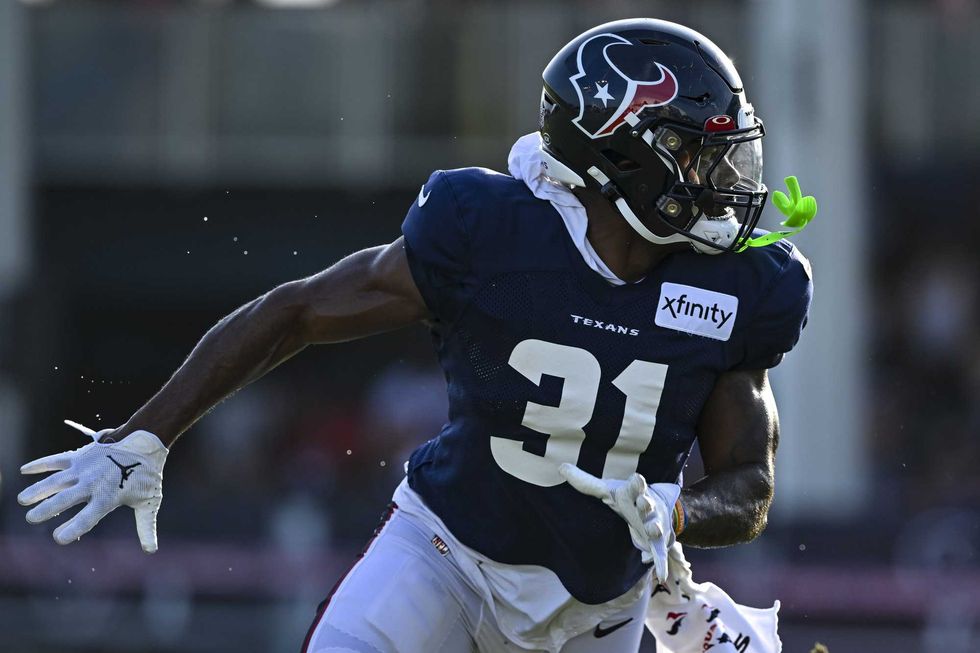 Houston Texans running back Dameon Pierce (31) catches a pass during training camp at the Texans practice facility.