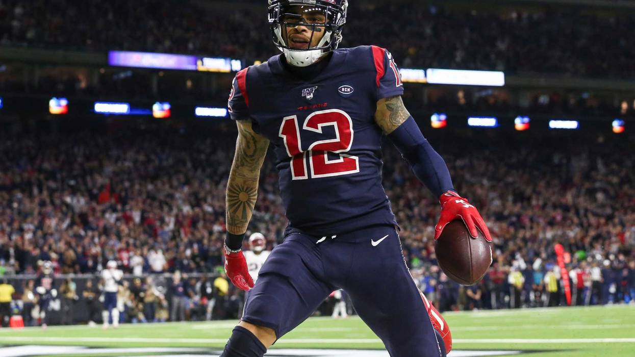 Houston Texans wide receiver Kenny Stills (12) scores a touchdown during the third quarter against the New England Patriots at NRG Stadium.